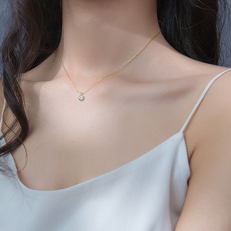 Detailed shot of the gold evil eye choker necklace, highlighting the cubic zirconia stones.