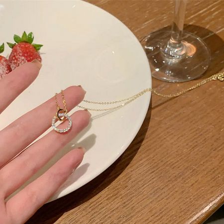 A stylish presentation of the gold-plated zircon necklace.