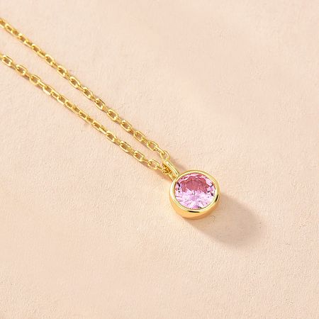 Elegant gold necklace showcasing a delicate pink zircon birthstone pendant.