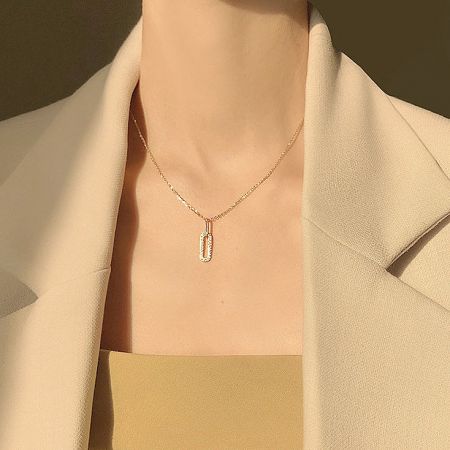 Detailed view of the gold-finished 925 sterling silver oval CZ zircon pendant necklace.