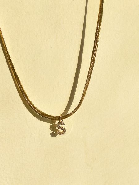 The stylish 'S' initial pendant necklace, adorned with brilliant clear gemstones.