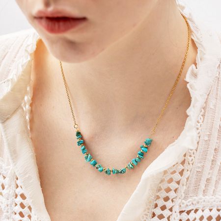 Stainless Steel Irregular Turquoise Rock Bead Necklaces (Set of 5) - A model wearing a stylish gold-tone stainless steel necklace adorned with irregular turquoise rock beads, showcasing its elegant drape.
