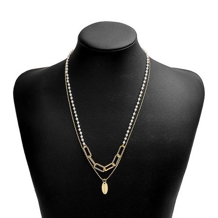 Close-up of the White Pearl Strand Necklace on a black display bust, highlighting its layered design.