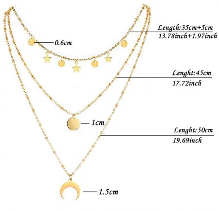 Detailed view of the gold-plated triple chain necklace with star, circle, and crescent moon charms.