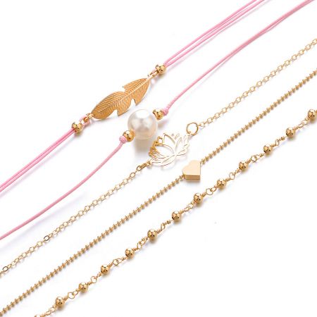 A mix of gold chain and pink cord necklaces with various charms.