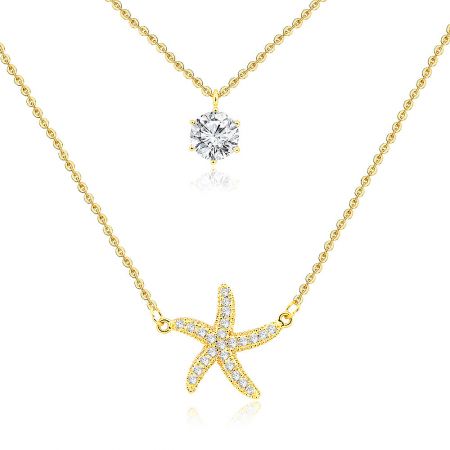 Close-up view of the two gold necklaces, highlighting the single large round diamond pendant and the starfish-shaped pendant encrusted with smaller diamonds.