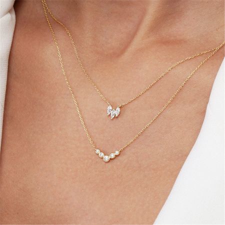 Two sterling silver zircon necklaces displayed side-by-side to show variations.