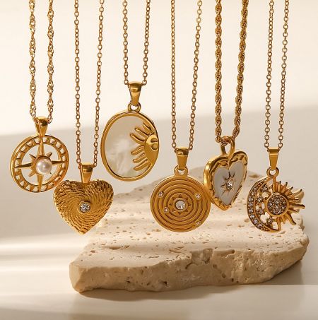 A selection of 18K gold-plated necklaces with diverse pendant styles, showcasing custom jewelry options.