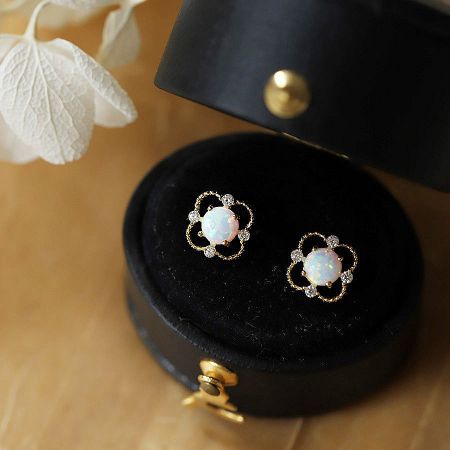 The set of sterling silver opal and zircon earrings presented in a professional black jewelry box, ideal for wholesale.