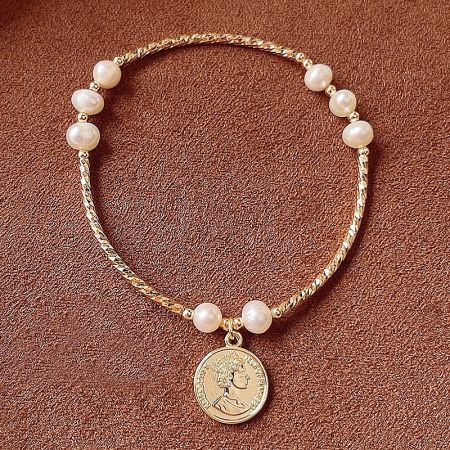Full view of the gold bracelet with lustrous pearl beads and a vintage-style coin pendant.