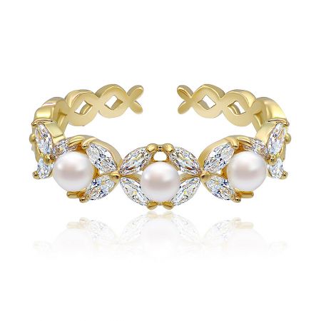 Triple White Pearl and CZ Ring in Gold Plated - A close-up of the Triple White Pearl and CZ Ring, showcasing its three brilliant white pearls and sparkling cubic zirconia stones set on a polished gold-plated band.