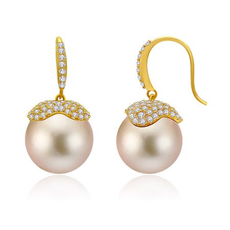 Champ Pearl Drop Hook Earrings - A close-up of the Champ Pearl Drop Hook Earrings, showcasing the lustrous champagne-colored pearl, sparkling cubic zirconia accents, and elegant gold-plated hook.