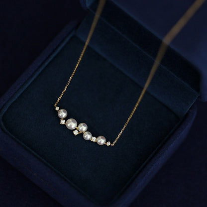 The shell pearl necklace set presented beautifully in a jewelry box, perfect for gifting.
