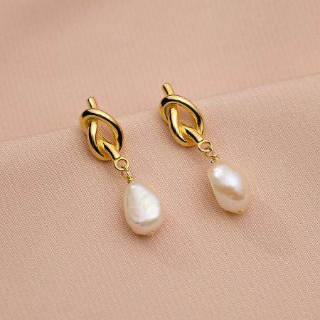 Another angle of the gold-plated pearl drop earrings.