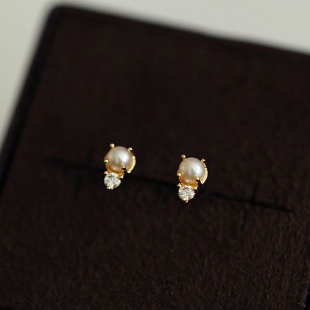Detailed view of another pair of pearl and cubic zirconia earrings from the sterling silver set.