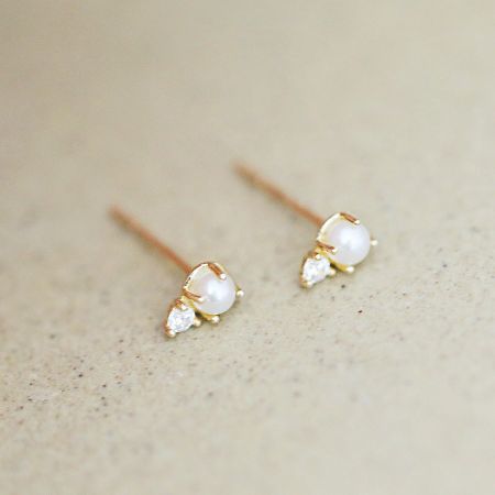 Showcase of the intricate design of the sterling silver pearl stud earrings.