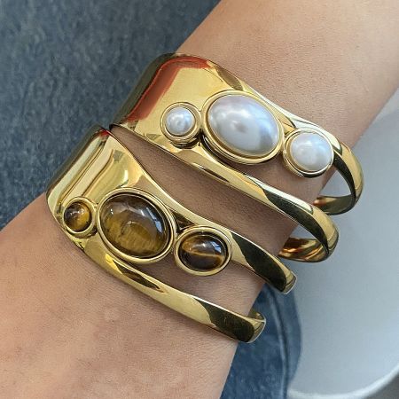 Gold Gemstone Bracelet Set of 5 with Pearl and Tiger Eye Cuff - Close-up of a gold-finished stainless steel cuff bracelet set, featuring one with a natural pearl and another with a tiger-eye stone, perfect as a Valentine's gift.