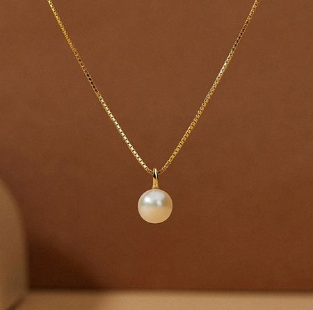 925 Sterling Silver Gold Plated Minimal Pearl Necklace - A delicate 925 sterling silver necklace with gold plating, featuring a single, elegant freshwater pearl pendant on a white background.