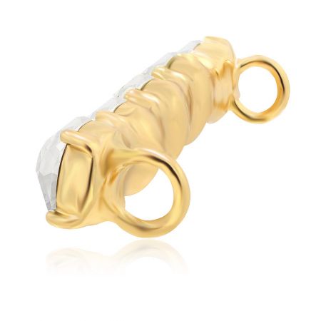 The gold shoe charm pendant highlighting its ribbed texture and crystal elements.