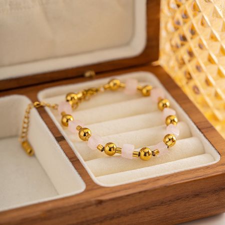 Another view of the pink beaded bracelet set inside a premium wooden presentation box.