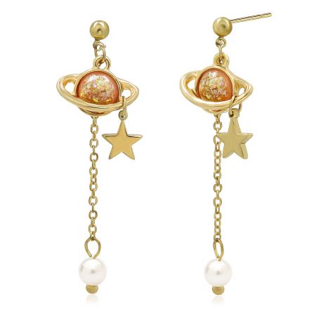 Detailed view of the gold planet earrings with stars and pearls, showing the orange and white accents.