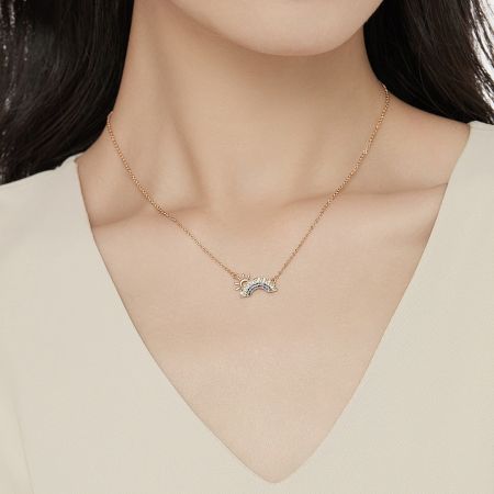 A model wearing the 18K gold plated rainbow pendant necklace, showcasing its elegant look.