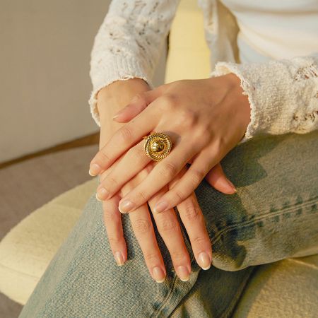 A simple yet elegant gold-tone open band ring, part of the five-piece set.