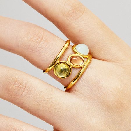 Multiple rings from the set displayed together to show variety.