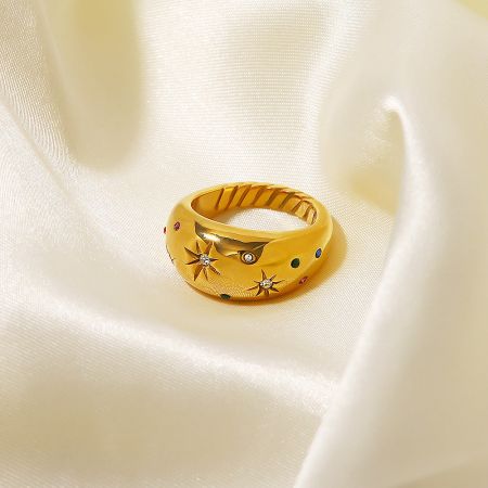 Detailed view of the gold-plated star ring showcasing the vibrant gemstones.