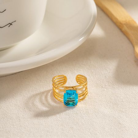 A clear view of the modern, multi-layered band of the adjustable gold ring.