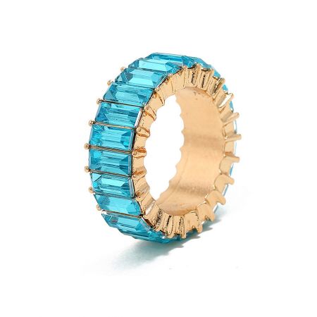 Detail shot of the eternity ring highlighting the brilliant blue cubic zirconia stones.