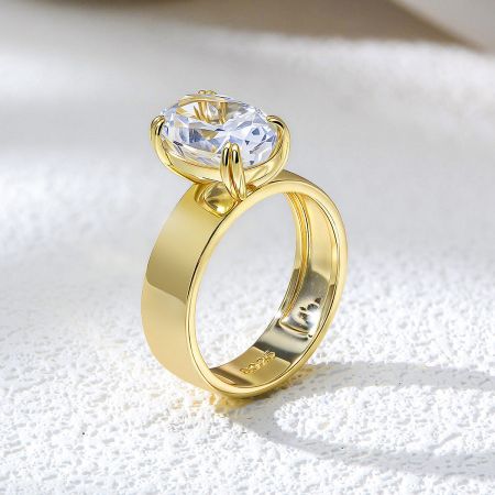 Detailed shot of the four-prong setting holding the brilliant oval cubic zirconia stone.