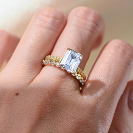 A model wearing the Taylor Swift inspired cushion cut CZ cocktail ring, showcasing its elegant design on hand.