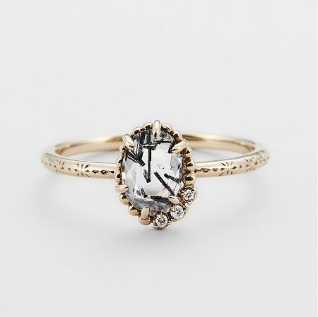 925 Sterling Silver Salt And Pepper Gem Stone Ring - Close-up of a 925 Sterling Silver Salt and Pepper Gem Stone Ring with a gold finish, showcasing the intricate floral pattern etched on the band and the unique inclusions within the central gemstone.