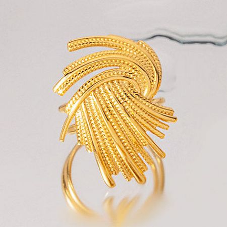 Another perspective of the gold ring with a distinctive curved design.