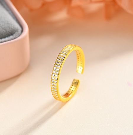 925 Sterling Silver Micro Pave CZ Adjustable Band Ring - A detailed studio photograph of the 925 Sterling Silver Micro Pave CZ Adjustable Band Ring, highlighting the intricate micro pave setting with sparkling cubic zirconia stones on a gold-plated band.