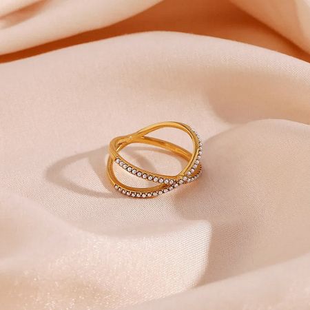 Close-up of the double curved bands with delicate pearl accents.