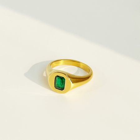 Detailed shot of the signet ring featuring a rich green square CZ stone.