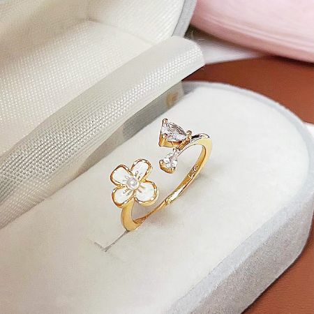 A beautifully crafted gold ring with a floral and bird-like motif, part of the 5-piece set.