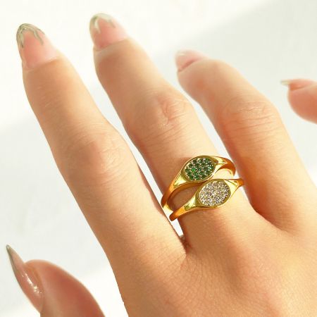 Stainless Steel Micro Pave Zircon Oval Signet Rings - Set of 5 - A close-up of a stainless steel oval signet ring from the set of 5, featuring a beautiful micro pave setting with green and white zircon stones.
