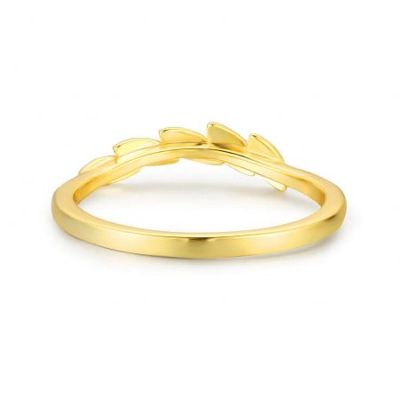 A different angle of the gold leaf ring, showing the unique intertwined design of the band.