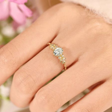 Front view of the Olive Branch ring, highlighting the large central zircon.