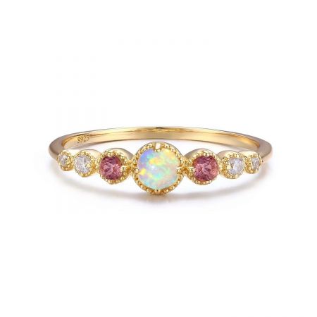Angled view of the 925 silver ring, revealing the intricate prong setting and colorful play-of-color in the opal.
