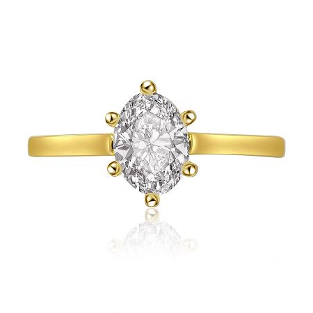 Oval Cut Solitaire Ring with Grooved Band - Elegant oval cut solitaire ring with a grooved gold band, featuring a sparkling white cubic zirconia stone.