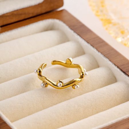 The elegant pearl ring set displayed in a jewelry box, showcasing its design.