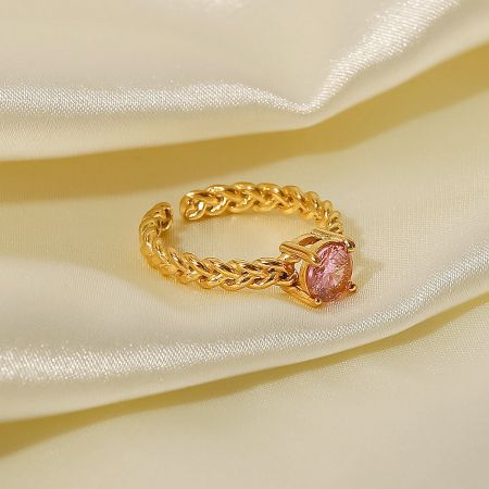 Close-up of the adjustable open ring with a charming pink cubic zirconia stone.