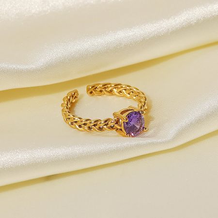Close-up of the adjustable open ring with an elegant purple cubic zirconia stone.