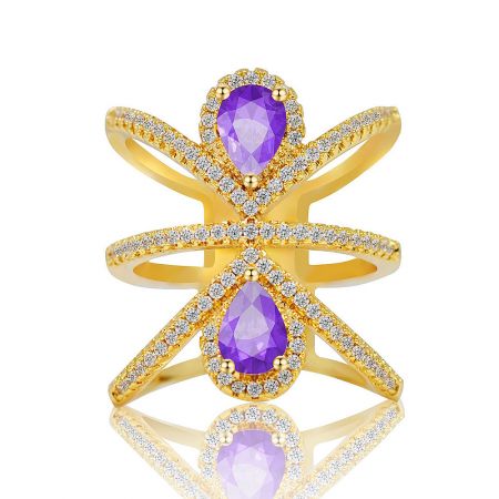 Gold Plated Purple Cocktail Wide Ring - A close-up of the Gold Plated Purple Cocktail Wide Ring, showcasing its intricate design with two large purple gemstones and surrounding white cubic zirconia stones on a multi-strand band.