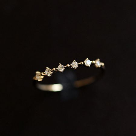 Top-down view of a single 925 sterling silver zircon ring in a polished gold finish.