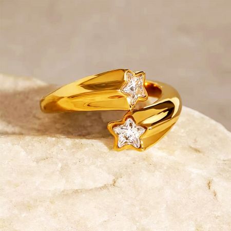 Close-up view of the adjustable gold star ring with brilliant zircon accents.